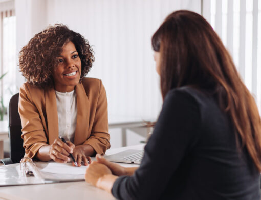 Woman,Consulting,With,A,Female,Financial,Manager,At,The,Bank